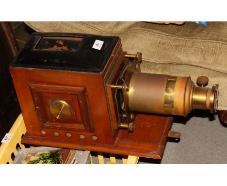 A late 19th Century magic lantern together with a large collection of contemporary slides, including America's Cup 1895, humo