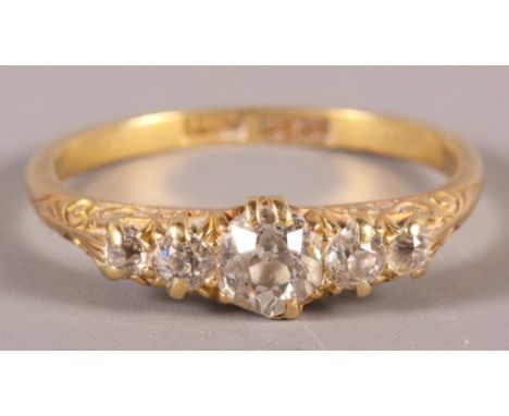 An Edwardian 18ct gold and diamond five-stone dress ring, size S