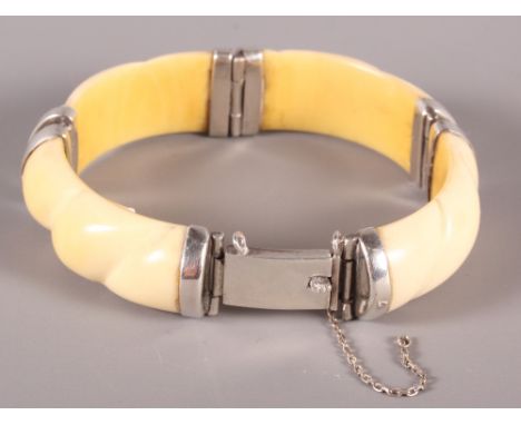 A 1930s white metal mounted ivory bracelet