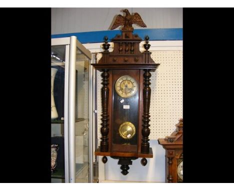 An antique wall clock, eagle surmount - 100cms