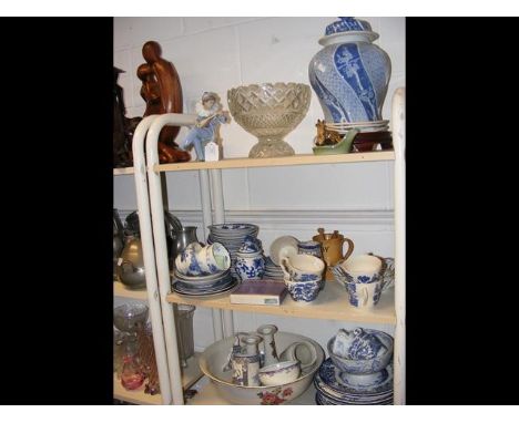 A table lamp, Nao figure, blue and white tea set etc (contained on three shelves)