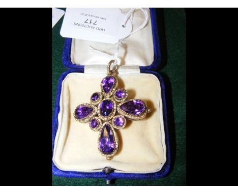 An antique ladies amethyst and yellow metal cross shaped pendant - 5cm x 5cmCONDITION REPORTBy our judgement, condition of lo