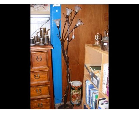 A metal floral standard lamp together with Oriental stick stand