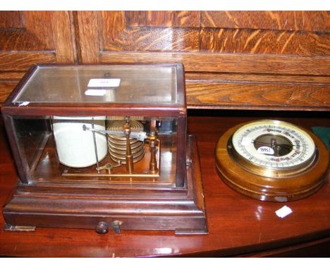 An antique barograph together with a wall barometer