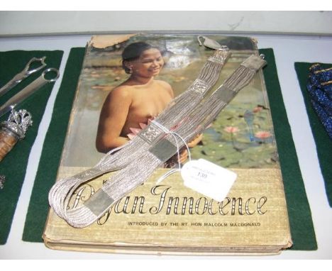 'Pagan Innocence' by K F Wong, together with a ladies white metal belt
