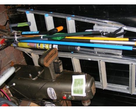 A selection of garden tools together with two ladders