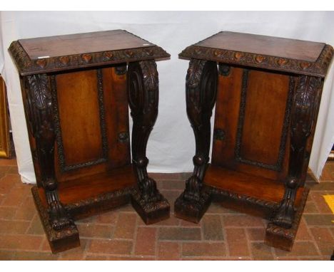 An impressive pair of 19th century oak console tables, having heart shaped carved frieze design to the top on cabriole suppor