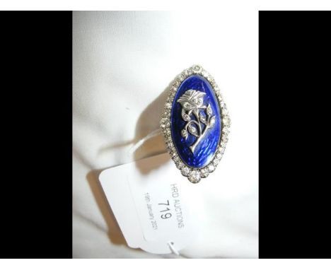 A ladies antique diamond and blue enamel dress ring with central flower - the ring measuring 3.5cm x 2cmCONDITION REPORTBy ou