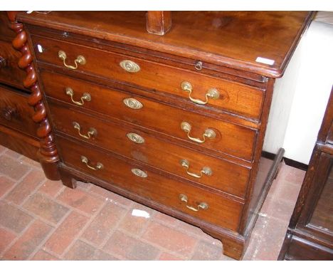 A Georgian mahogany small proportioned bachelor's chest with brushing slide and four graduated drawers below - width 69cms, h