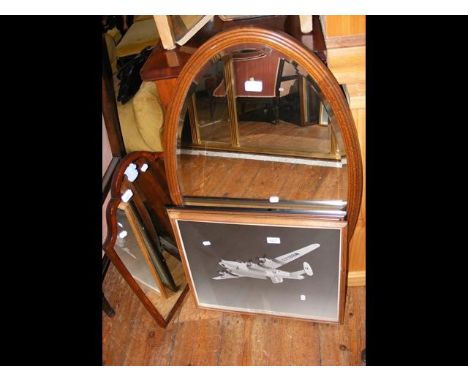 Two mirrors together with two aeronautical prints