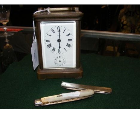 A carriage clock for restoration together with silver bladed fruit knife