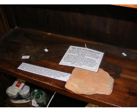 'The Fox Weathervane' together with a fragment of Roman box flue tile
