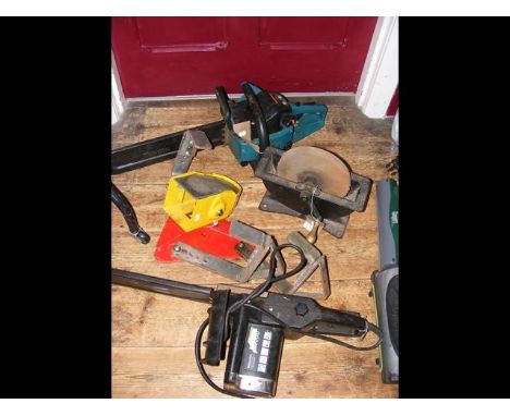 A wheel clamp, chainsaw, knife sharpener etc