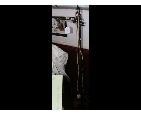 A stylish standard lamp and one other
