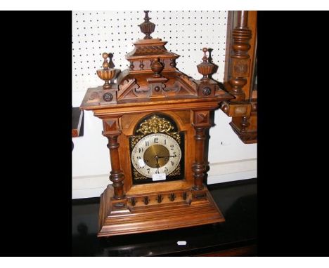 An antique mantel clock with striking movement