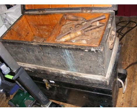 An old tool chest containing collectable tools and one other
