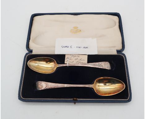 A cased pair of George III Old English pattern silver fruit spoons, probably by John Lambe, London 1798, with engine turned e