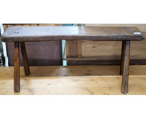 A 19th century elm bench stool with plank seat on chamfered splayed supports, 40cm high x 88cm wide x 28cm deep Condition Rep