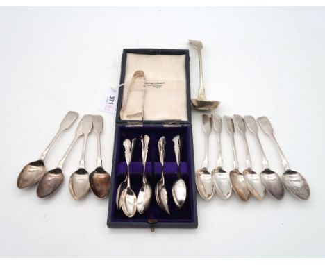 A collection of silver flatware including a cased set of twelve George V silver tea spoons and sugar tongs, by Deakin &amp; F