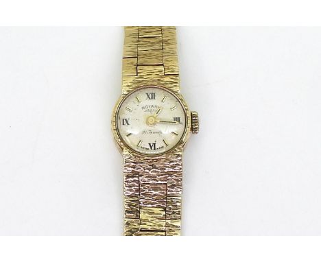 A 9ct gold retro ladies Rotary watch, diameter of the case 15mm, length of bark textured strap16.5cm, weight including mechan