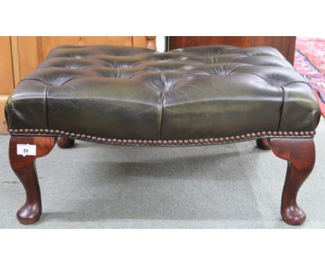 A 20th century forest green leather button upholstered footstool on cabriole supports, 30cm high x 63cm wide x 48cm deep Cond