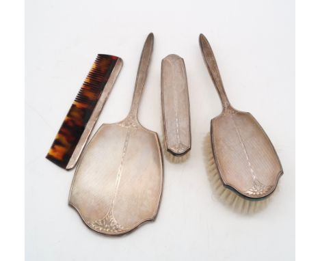 A boxed four piece silver dressing set, by Walker &amp; Hall, Birmingham 1958, with engine turned and engraved decoration (4)