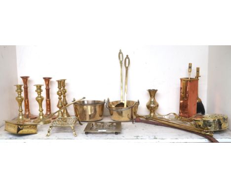 A mixed lot of assorted brass wares to include candlesticks, nut warmers, trivets, fire tools etc Condition Report:Available 