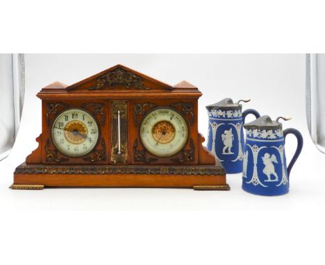 An oak cased desk clock and barometer and two Wedgwood jugs Condition Report:Available upon request