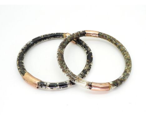 Two unusual 9ct gold mounted, glass bangles filled with opal chips and oil? weight together 60.8gms Condition Report:Availabl