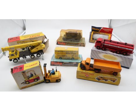 Boxed/packaged Dinky Toys of mixed age, comprising 409 Articulated Lorry, 404 Conveyancer Fork Lift Truck, 696 Leopard Anti-A