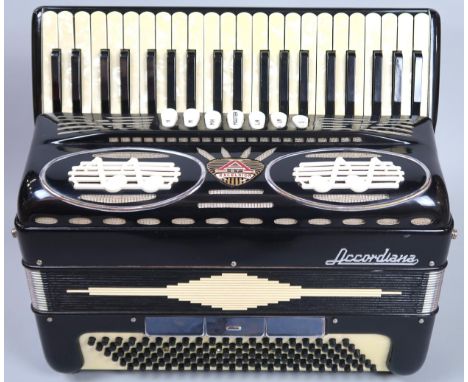 EXCELSIOR ACCORDIANA 120 bass 41 key accordion with stylised quaver grille and faux mother of pearl keys, with case. Conditio