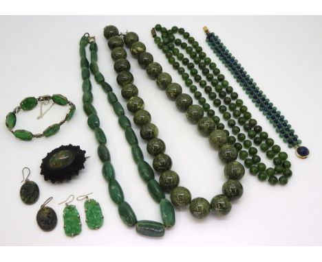 a 9ct white gold mounted Chinese green hardstone bracelet and earrings (af) weight together 15.7gms, with a apir of earrings 