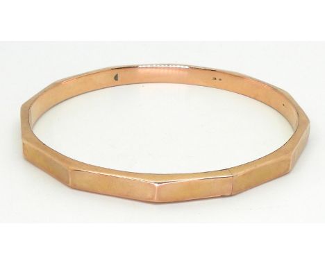 A 9ct gold faceted bangle, inner diameter 7.2cm, weight 11.4gms Condition Report:Available upon request