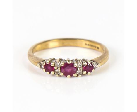 A late 20th century 9ct gold ruby and diamond ring, setting height 4.6mm, size O, 2.2gNo damage or repairs, all stones presen