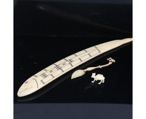 A marine ivory Cribbage marker, early 20th century, length 33cm, together with an ornate carved bone spoon, and a miniature c