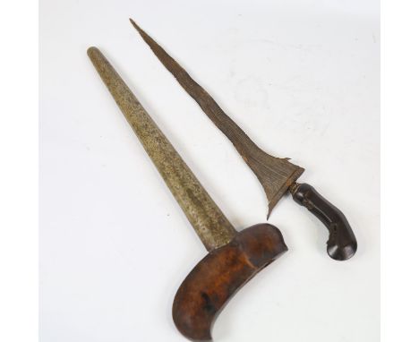 A Malayan Kris knife, with carved horn handle and white metal scabbard, overall length 52cm 