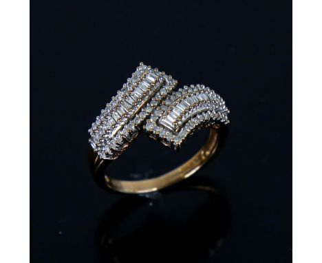 A modern 9ct gold diamond cluster crossover ring, set with eight-cut and baguette-cut diamonds, total diamond content approx 