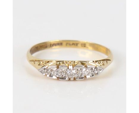 An early 20th century 18ct gold graduated 5-stone diamond half hoop ring, platinum tops set with old-cut diamonds, total diam