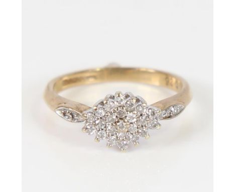 A modern 9ct gold diamond cluster ring, set with round brilliant diamonds, total diamond content approx 0.25ct, setting heigh