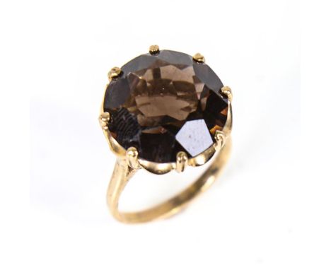 A large late 20th century 9ct gold smoky quartz dress ring, with openwork underbridge, hallmarks London 1973, setting height 