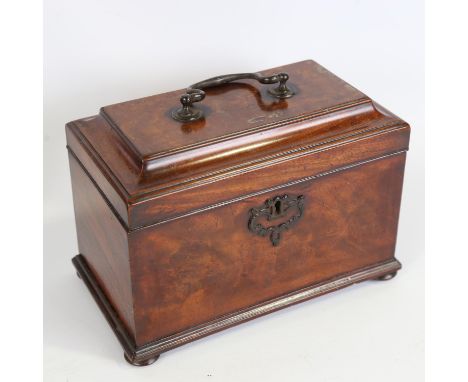 A George III mahogany tea caddy, with brass carrying handle and secret drawer in the base, length 23cm 