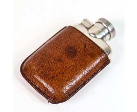 A small George V silver pocket hip flask, with fitted leather sleeve, by J C Vickery, hallmarks Chester 1923, height 8cm, 2oz