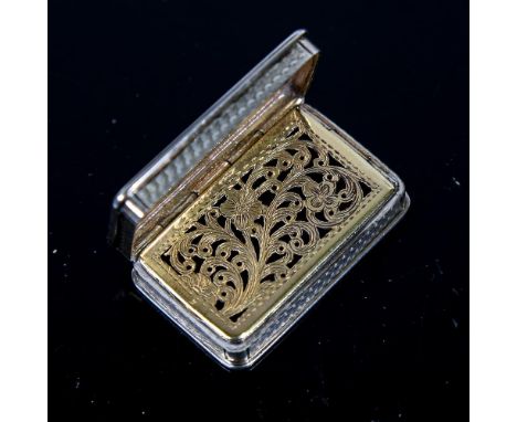 A Victorian silver vinaigrette, rectangular form with allover engine turned decoration, gilt interior, floral pierced and eng