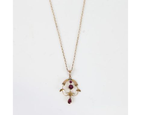 An Art Nouveau 9ct gold garnet pendant necklace, openwork floral design on unmarked 9ct chain, maker's marks H and W, pendant