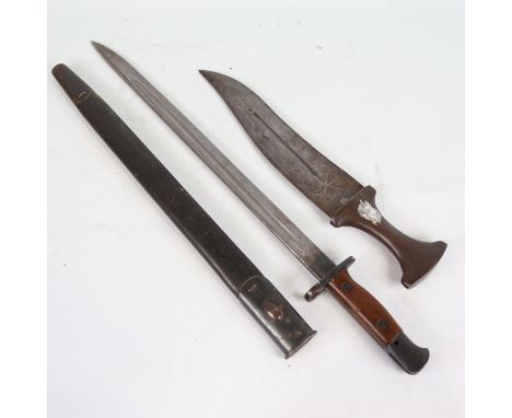 A Middle Eastern dagger with steel handle, overall length 36cm, and a First World War Period sword bayonet and scabbard (2) 