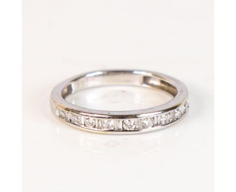 A modern 9ct white gold diamond half eternity ring, set with modern round brilliant and tapered baguette-cut diamonds, total 