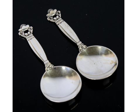 GEORG JENSEN - a pair of Danish sterling silver Acorn/Konge pattern tea caddy spoons, designed by Johan Rodhe, post 1945 mark