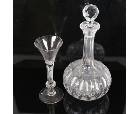 An 18th century cordial glass, with funnel-shaped bowl and air twist stem, height 18cm, and a cut-glass decanter (2) 