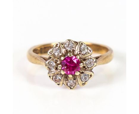 A mid-20th century 9ct gold ruby and diamond cluster ring, total diamond content approx 0.1ct, hallmarks Birmingham 1966, set