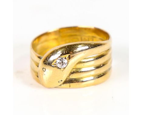 An early 20th century 18ct gold diamond coiled snake/serpent ring, the head set with old European-cut diamond, hallmarks Ches